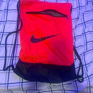 Neon orange Nike backpack